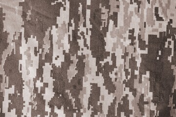 Texture of Dark green pixel camouflage military uniform textile cloth with folds