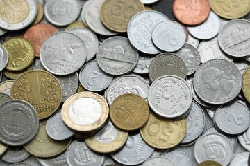 Big pile of different coins from various currencies and different countries around the world....