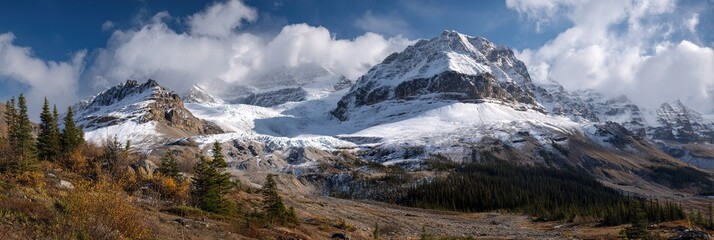 Autumn snowfall line marking glacier transition on Columbia Icefield, seasonal shift visualization for geography films or climate impact art.