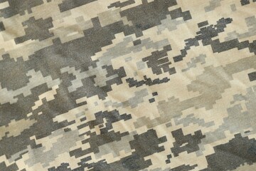 Texture of Dark green pixel camouflage military uniform textile cloth with folds