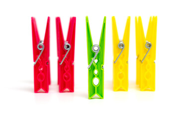 Leader concept and grouping. Differentiation and joint activity. One green clothespin ahead of...