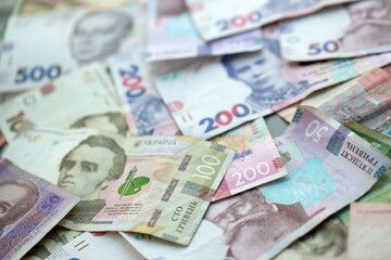Big amount of different ukrainian hryvnia currency money bills in pile