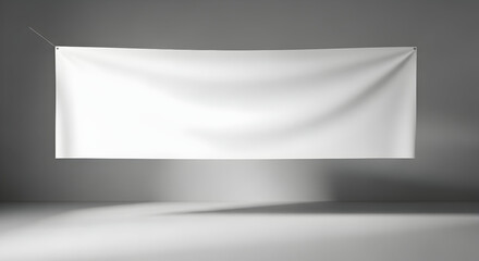 Modern minimalistic blank white banner hanging on gray wall for advertising or display purposes in contemporary interior design setting with soft lighting and shadow effects
