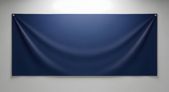 Blank navy blue fabric banner hanging on a plain gray wall suitable for advertising events or promotional displays in commercial settings