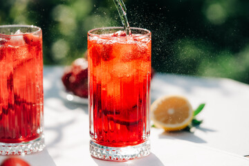 Amazing iced strawberry lemonade drinks. Still life, mojito cocktails for two.