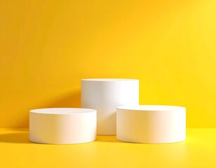 Three white cylindrical podiums on a bright yellow background, minimalist display.