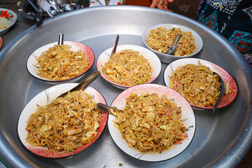 Fried tofu with boiled bean sprouts and various vegetables is are mixed salad, Burmese style. Place...