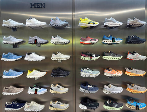 BANGKOK ,THAILAND  July 15, 2025 : On Cloud Running shoes are against the wall on display at a running shoe specialty store. On is a Swiss Company at siam paragon department store