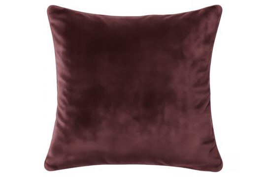 Plush dark red velvet cushion resting on transparent surface, enhancing luxurious home decor with sophisticated textile texture