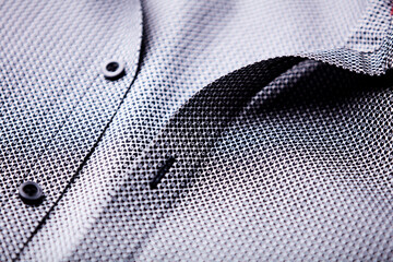 Close up of dark Men's shirt. Soft focus. Copy space.	
