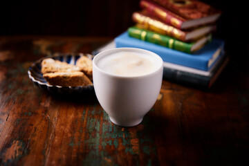 Cappuccino on dark wooden background. Soft focus. Close up.	