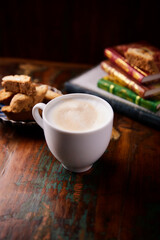 Cappuccino on dark wooden background. Soft focus. Close up.	