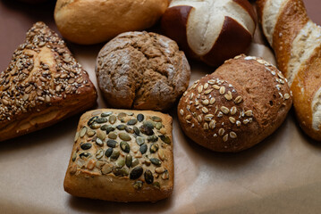 Various types of crusty German breads and flaky pastries offer a delicious spread, perfect for a breakfast or brunch setting