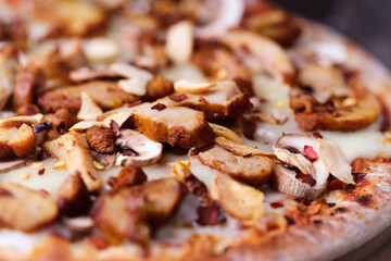 Gyros Pizza with with champignons and mozzarella cheese. Wooden background. Soft focus.