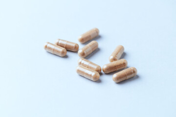 Lutein capsules. Dietary supplement on bright background. Soft focus. Close up. Copy space.	