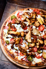 Gyros Pizza with jalapeno pepper, cherry tomatoes and mozzarella cheese. Soft focus. Close up.