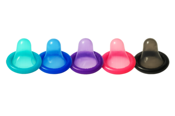 Set of multi-colored twisted latex condoms, on an isolated background. Condoms, contraceptives for safe sex, prevention of STDs, sexual health.