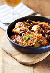 Grilled chicken pieces with kalamata olives and fresh rosemary. Close up.