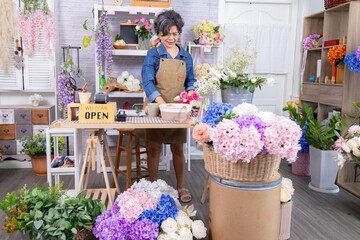 Asian florist senior woman lifestyle, small business elderly female arranging shop flowers near...