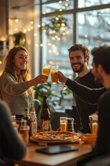 Friends celebrating with drinks and food in a cozy setting.