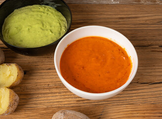 Red mojo rojo and green mojo verde sauces, traditional Tenerife dips, mojo picon dressing