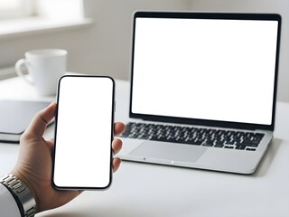 Phone mockup with empty screen held by hand at workplace desk setup with laptop, ideal for UI/UX showcase, app preview, or marketing text overlay. Clipping path included