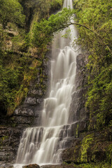 Fototapeta premium View of the waterfall Chontales in long exposure shot, in the eastern Andean mountains of central Colombia, near the town of Sotaquira.