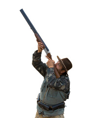 Hunter man in camouflage with a gun during the hunt in search of wild birds or game.