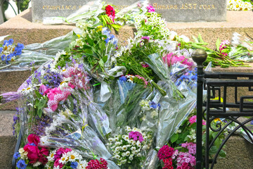 bouquets of flowers on the grave of poet A.S. Pushkin