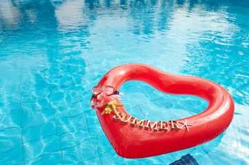heart shaped float ,snorkeling, and summer items at the resort pool