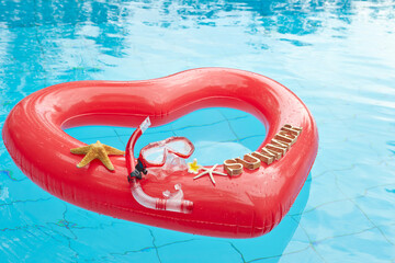 heart shaped float ,snorkeling, and summer items at the resort pool
