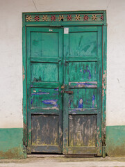 Old wooden door of an abandoned house, in the town of Sotaquira, in the eastern Andean mountains of central Colombia.