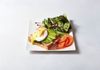 Avocado sandwich with salad on a plate