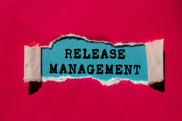 Release Management message written on ripped torn red paper on blue background. Conceptual Release Management symbol. Copy space.