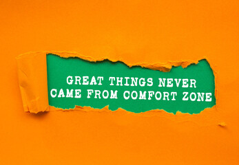 Great Things Never Came From Comfort Zone message written on ripped torn orange paper on green...