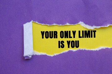 Your Only Limit is You message written on ripped torn purple paper on yellow background. Conceptual...