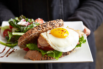Sandwich with salad on a plate