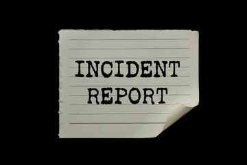 Incident report message written on ripped torn paper piece on black background. Conceptual incident...