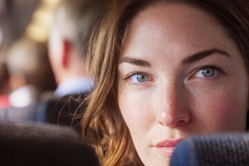 Vigilant gaze: a woman's intuition amidst urban chaos. Street safety. International travel safety: staying aware and secure in crowded places. Tube travel tips. Travel security.