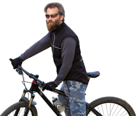 Sports brutal bearded guy on a modern mountain bike. Cyclist on the green hills in the spring.