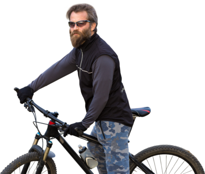 Sports brutal bearded guy on a modern mountain bike. Cyclist on the green hills in the spring.