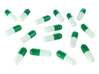 Bulk green and white capsule pills isolated on white background.