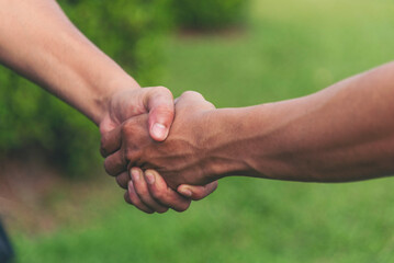 Trust honesty business customer handshake together promise respect partner. Businessman diversity...