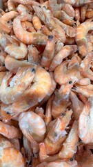 Fresh shrimps in fish shop background. seafood flat lay.