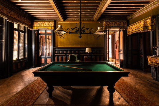 Abandoned Château Billiard Room with Vintage Decor and Atmospheric Natural Light in France