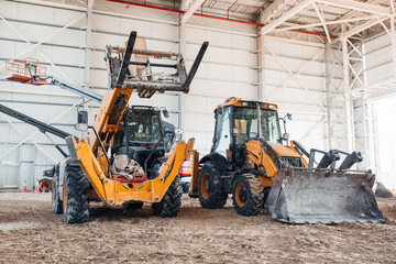 Forklift or Construction Tractor Working at Building Site – Heavy Machinery at Construction Zone