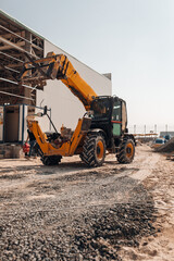 Forklift or Construction Tractor Working at Building Site – Heavy Machinery at Construction Zone