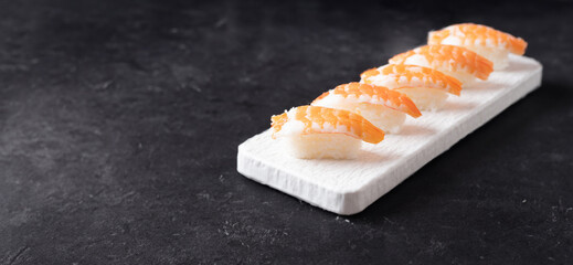 Shrimp sushi on a stone plate