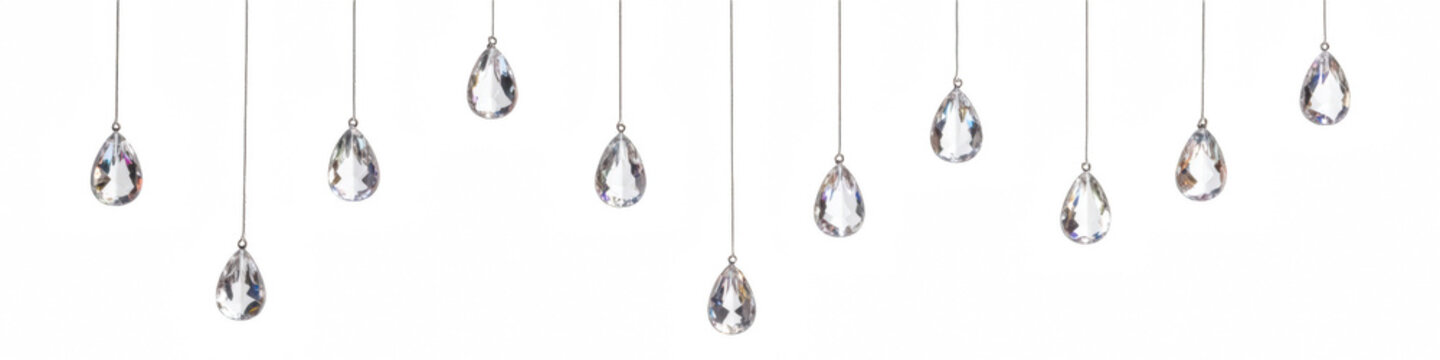Elegant crystal droplets hang gracefully, reflecting light and creating stunning visual display. Perfect for adding touch of luxury to any setting