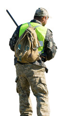 Hunter man in camouflage with a gun during the hunt in search of wild birds or game.